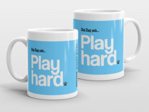 Blue mugs with "Play hard" text and paw print design.