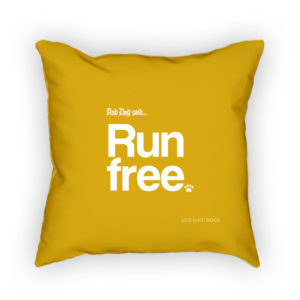 Yellow pillow with "Run Free" and paw print design.