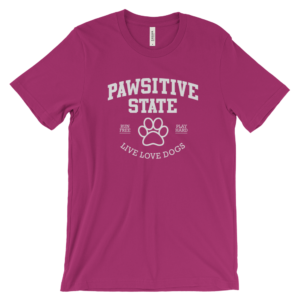 Pink t-shirt featuring "Pawsitive State" and dog paw design.