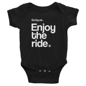 Black baby onesie with "And Dog said... Enjoy the ride" text and paw print.